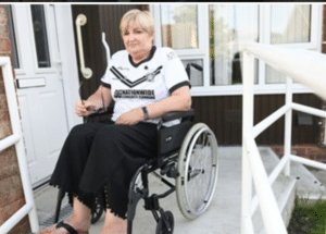 Rachael in self propelling wheelchair