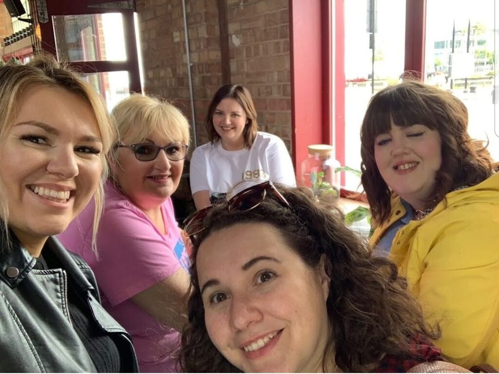 Rach, Violet, Jen, Emma and Kat sat at a table in Thieving Harry's smiling